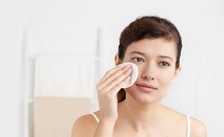 Bioderma - woman cleansing her face